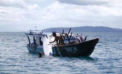 Daily boat rides to the surf included